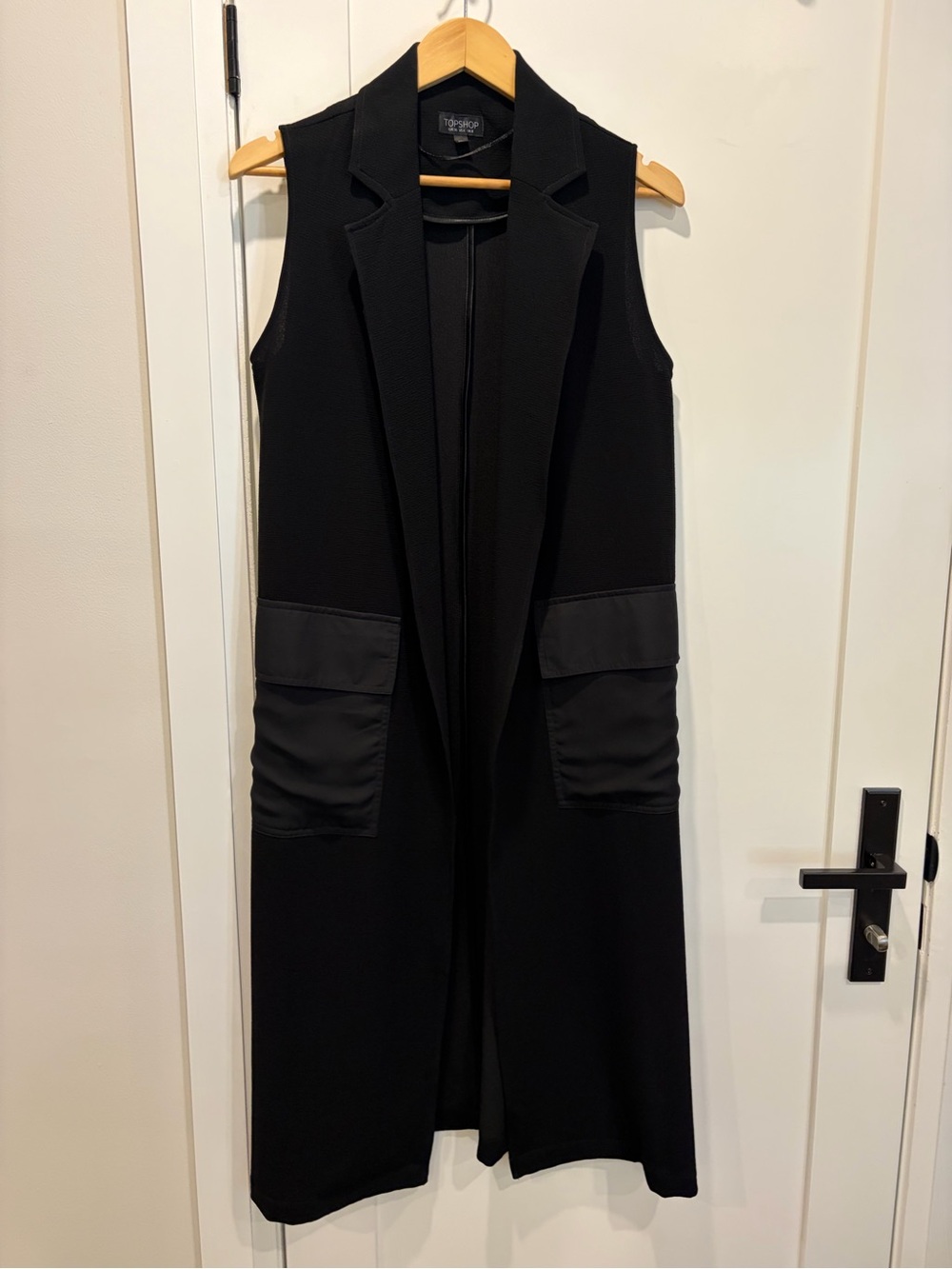 Label-only image of women's top